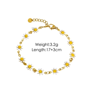 Detail of gold titanium steel daisy bracelet with white enamel flowers and adjustable clasp