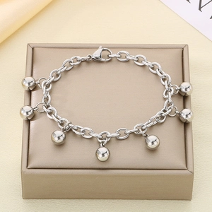 Detailed shot of silver beaded chain bracelet with seven spheres and lobster clasp
