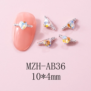 Macro detail of 10x4mm heart-shaped nail charms with AB crystal and silver metal frame