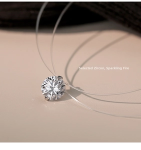 Detailed macro view of sparkling round cut moissanite pendant on invisible nylon thread