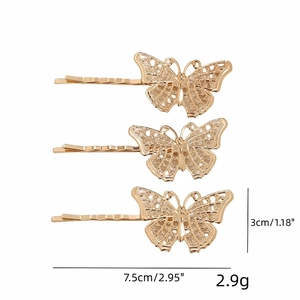 Three gold metal bionic hollow butterfly hair clips with size measurements 7.5cm length