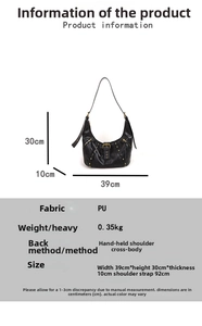 Detail view showing black oil wax leather crescent bag dimensions and gold rivet accents