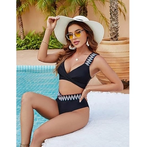 Two-piece black bikini set with bohemian geometric embroidery and cross V-neck design