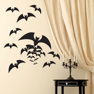 Black PVC bat wall stickers set for Halloween party decor on minimalist indoor wall