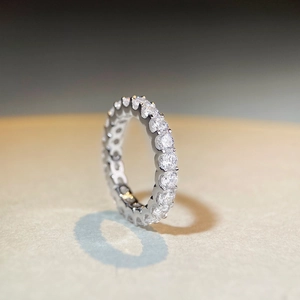 Macro side view of S925 sterling silver eternity ring with full moissanite stones