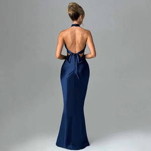 Elegant navy satin backless dress with a large bow and mermaid hem, studio back view