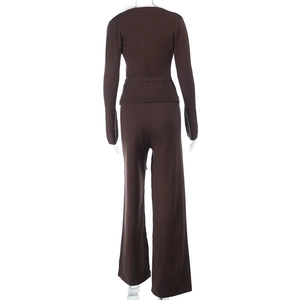 Close-up of the back view of a dark brown knitted two-piece set with wide-leg trousers