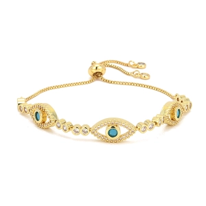 Adjustable 18K gold plated evil eye bracelet with blue zircon charms on white background