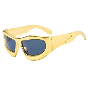 Futuristic oversized gold metal frame sunglasses with dark grey lenses in Y2K style