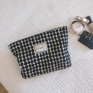 Minimalist geometric cotton makeup bag with black and white pattern and zipper closure