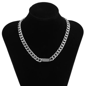 Close-up of silver Cuban link necklace with a flat rectangular blank metal plate on a neck mold