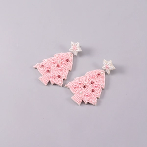 Detail of handmade pink beaded Christmas tree earrings with pearls and rhinestones