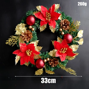 Detailed view of a 33cm Christmas wreath with red poinsettias and golden leaves