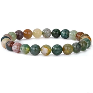 Close-up of natural colorful crystal and agate beads with unique textures on bracelet