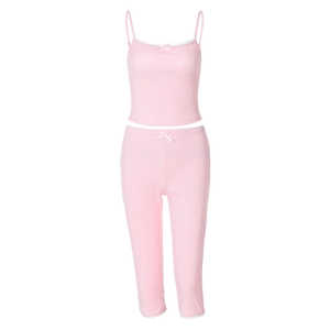 Detail of pink ribbed loungewear set with white lace trim and delicate bow accents
