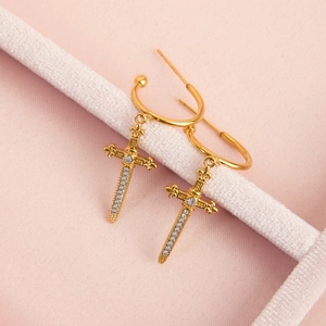 Detail of 18k gold plated stainless steel cross sword earrings with inlaid zircons
