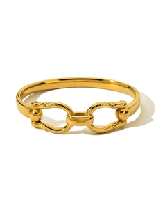 Detail of 18K gold-plated double-ring bangle with intricate spiral textures and clasp