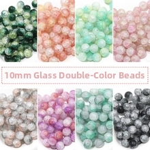 Dettaglio di perline di vetro crackle bicolore da 10mm per gioielli fai-da-te e hobby