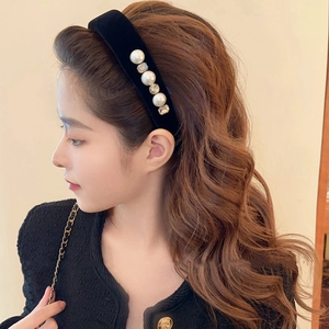 French vintage black velvet headband with elegant pearls and crystals worn by a model