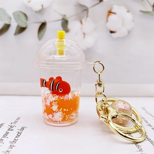 Macro view of a liquid-filled acrylic keychain with floating glitter and a clownfish toy