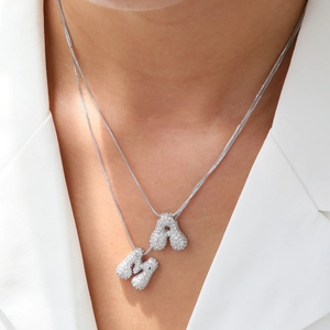Double layer silver necklace with paved A and M initial balloon pendants on box chain