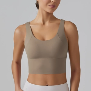 Detail showing the matte texture and elastic fabric of the coffee V-back sports bra