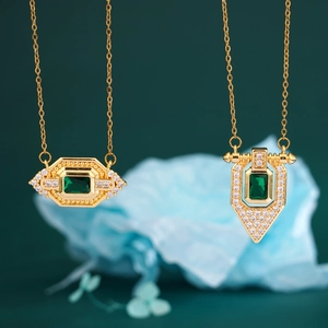 Vintage gold necklace with rectangular emerald pendant and pavé cubic zirconia accents