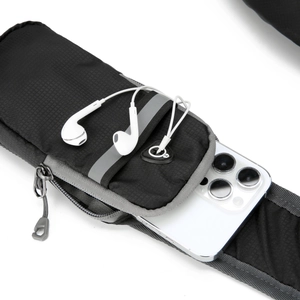 Detail showing water-resistant nylon fabric with earphone port and phone storage