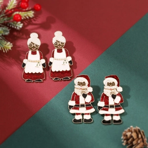 Detailed view of Christmas Santa earrings with red glitter enamel and pearl accents