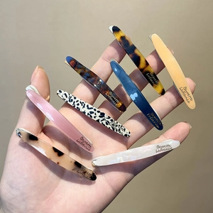 Set of 8 acrylic hair clips in various patterns including leopard and marble textures