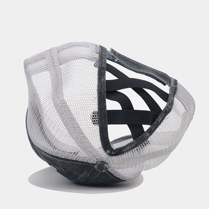 Detail of cross-elastic band for high pony tails on grey mesh baseball cap