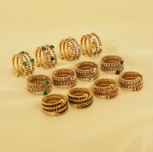 Detail of multi-layer 18k gold plated spiral rings with colorful zircon heart stones
