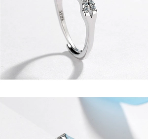 Macro shot of silver S925 hallmark engraving on polished minimalist cubic zirconia ring