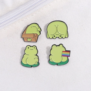 Set of four cute cartoon frog enamel pins in green finish for backpack decoration