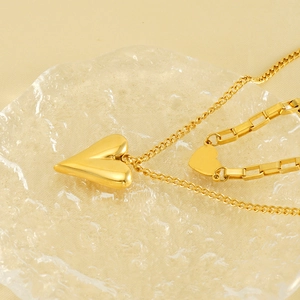 Polished gold double-layer heart pendant necklace and matching bracelet jewelry set