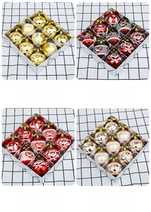 Detail of 12-piece Christmas ball ornament set with Santa and reindeer patterns in gift box