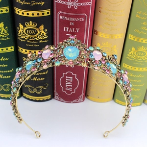 Macro detail of vintage gold bridal crown with multi-colored crystals and gems