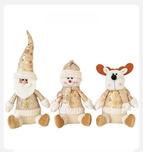 Front view of plush Christmas figures including Santa, snowman, and reindeer in gold sequins