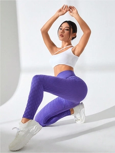 Detail of purple high-waisted yoga leggings featuring a unique diamond texture and high elasticity