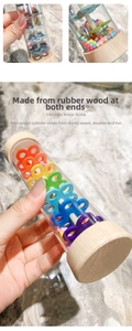 Macro detail of rubberwood ends and colorful internal beads of this rainmaker toy