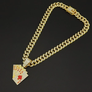 Close-up of gold Cuban link necklace with iced-out poker cards royal flush pendant