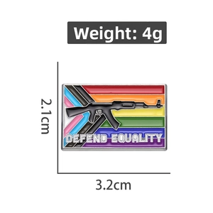 Detail view of rainbow enamel pin with rifle and Defend Equality text, 3.2cm x 2.1cm