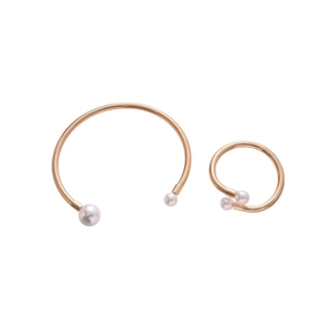 Minimalist rose gold bracelet and ring set with pearls on a clean white background