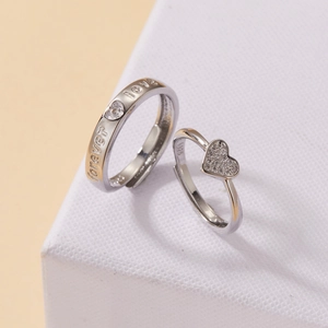 Detail of silver couple rings with forever love engraving and S925 hallmark