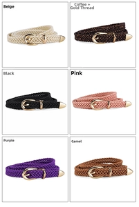 Detail view of thin woven belts in various colors with elegant golden pin buckles