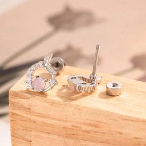 Elegant silver fishtail stud earrings with pink main stone and pavé zircon accents
