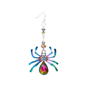 Macro shot of spider earrings with iridescent finish, colorful gemstones and white rhinestones