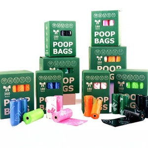 Macro shot of colorful biodegradable pet poop bags in blue green pink and black rolls