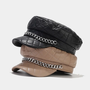 Quilted faux leather baker boy hat set in black and khaki with silver metal chain decor