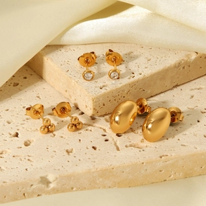 Three pairs of gold titanium steel earrings with zircon and polished oval designs